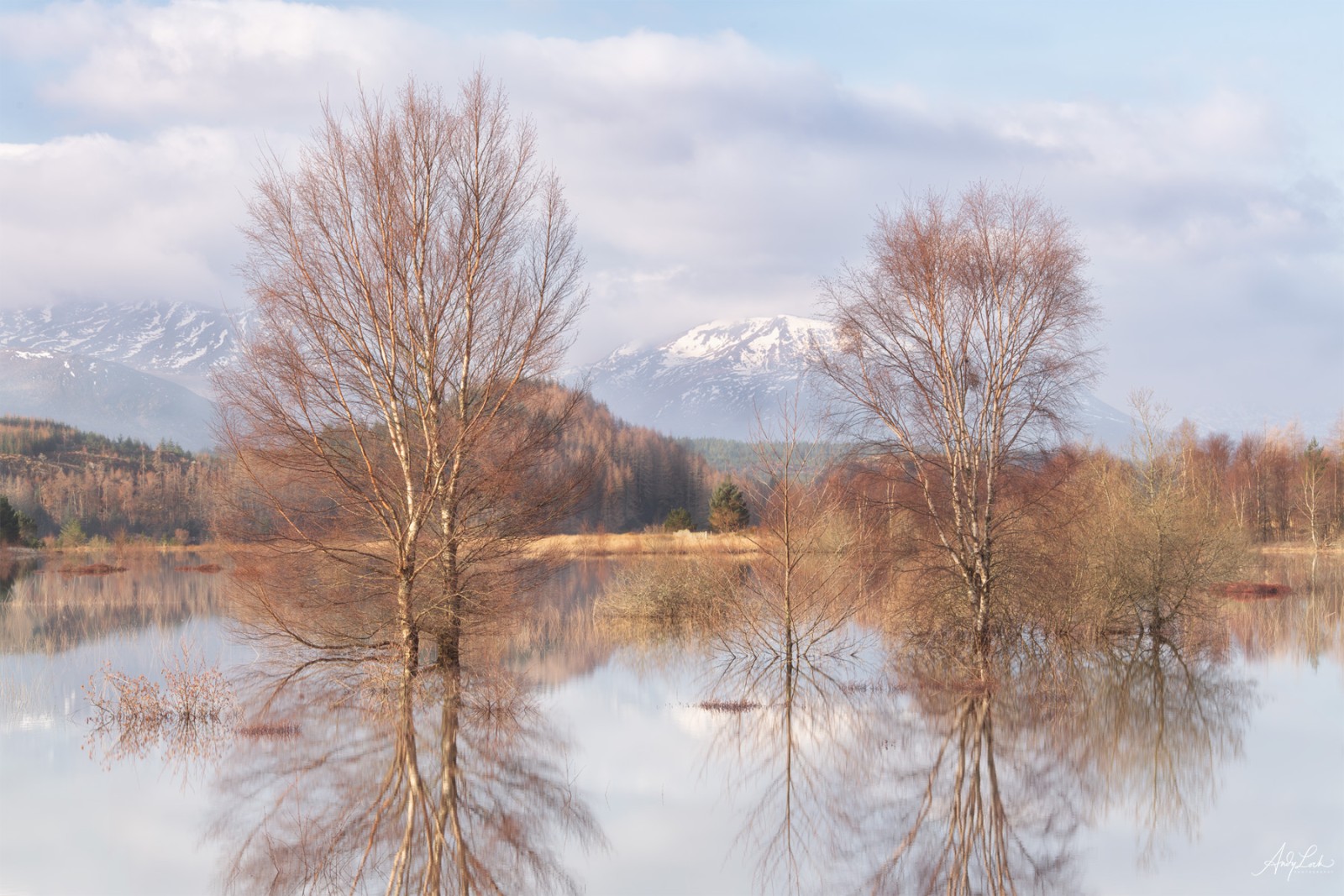 Winter reflections on a loch in the Scottish Highlands by Andy Lock